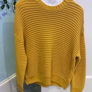 This cute sweater is from H&M!! It is orange/yellow color! It is a small.